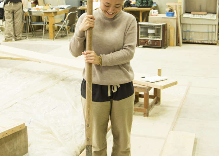 A ceramic relief is cut into some pieces before firing.